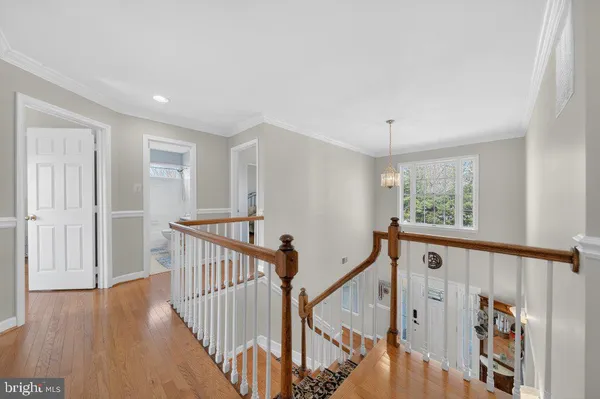 a view of an entryway with wooden floor