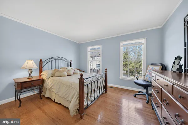 a bedroom with a bed next to a window with outer view