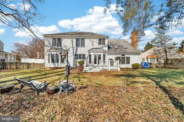 a view of a house with pool and sitting area