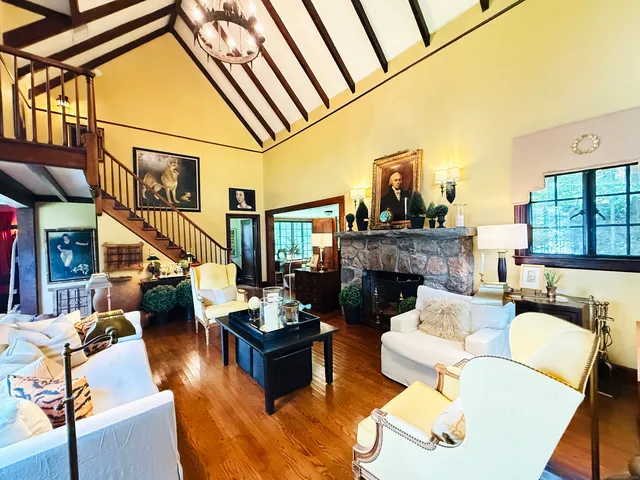 a living room with furniture and a fireplace