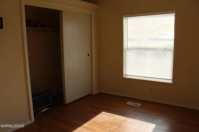 a view of an empty room and window