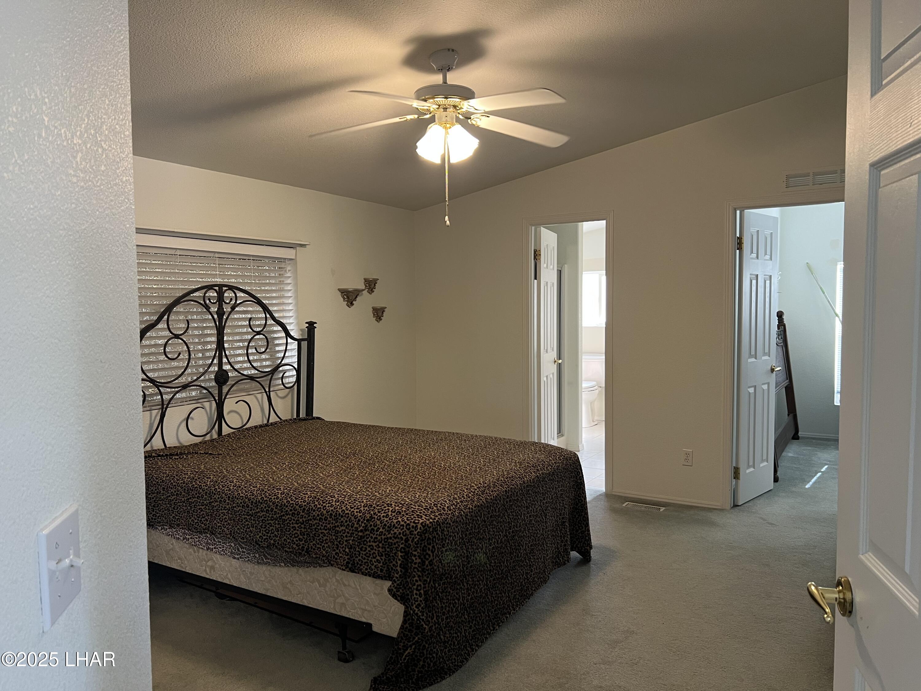 49688 Ruby Avenue Quartzsite, AZ 85346 - Photo 20 of 33 Primary bedroom - left side door to bathroom, right side to office/den