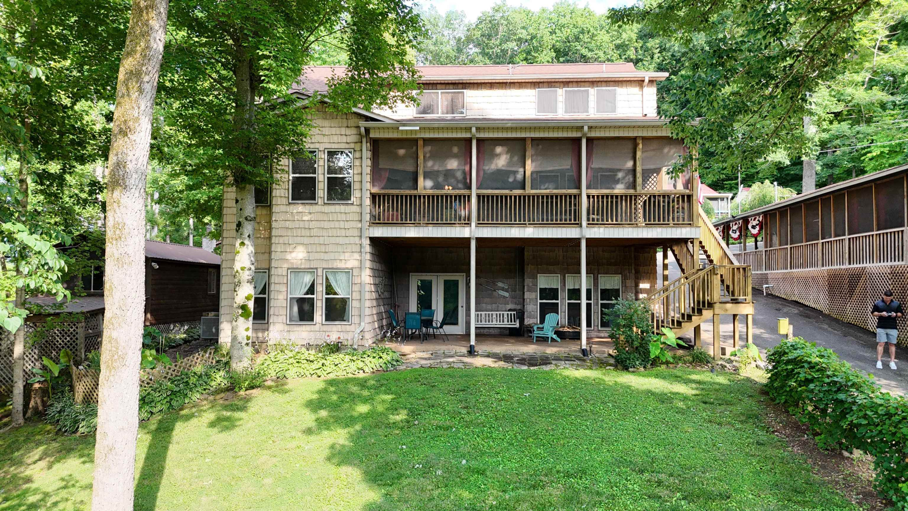 a view of an house with backyard porch and sitting area
