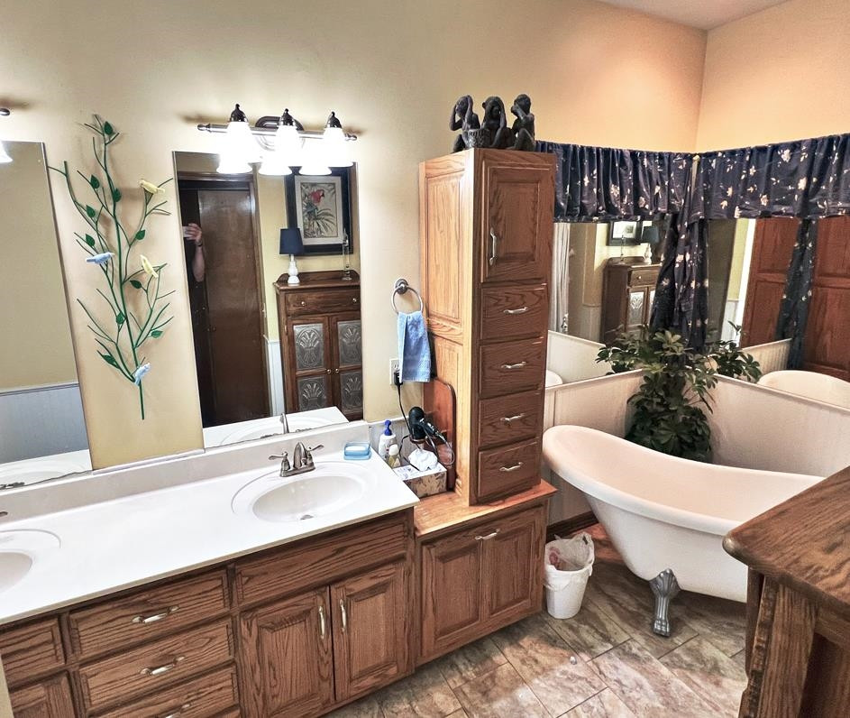 795 Lost Creek Boat Dock Road Decaturville, TN 38329 - Photo 13 of 34 a bathroom with a sink a toilet and mirror