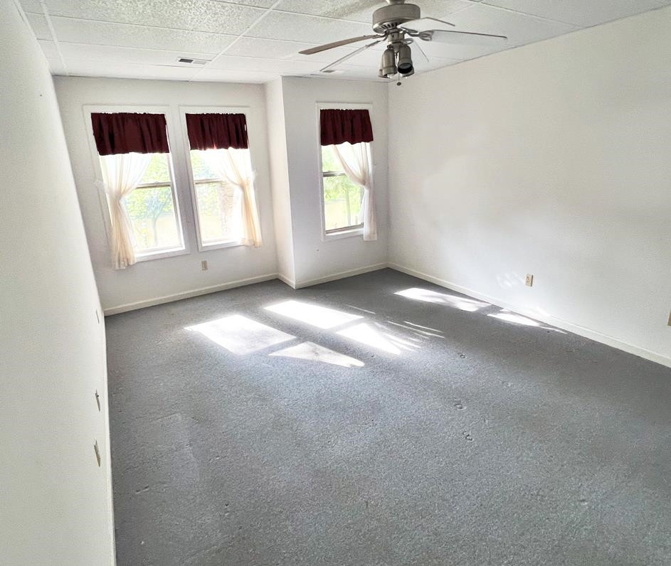 795 Lost Creek Boat Dock Road Decaturville, TN 38329 - Photo 18 of 34 a view of a big room with windows and chandelier fan