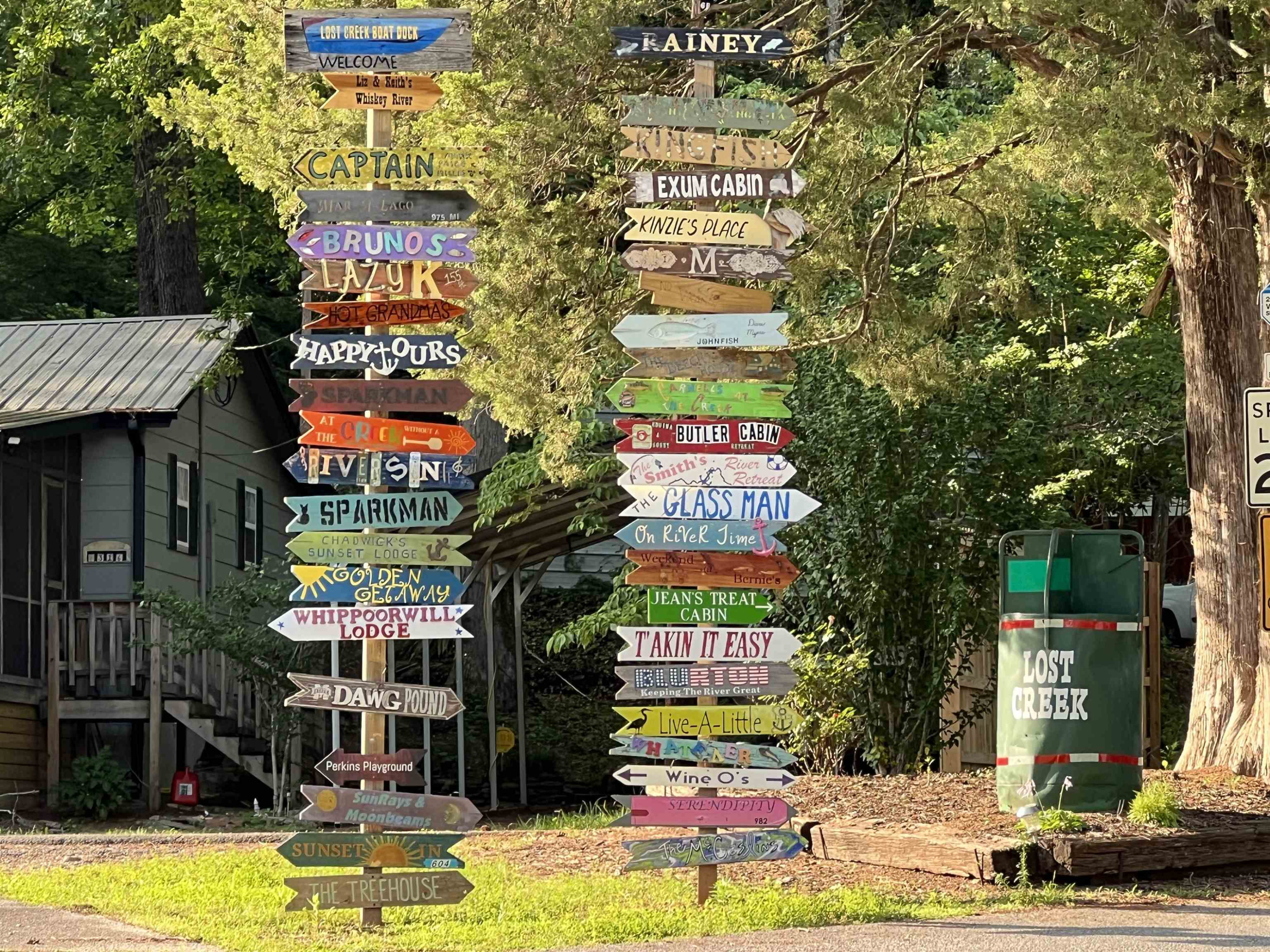 795 Lost Creek Boat Dock Road Decaturville, TN 38329 - Photo 2 of 34 a front view of multi story residential apartment building with yard and outdoor seating