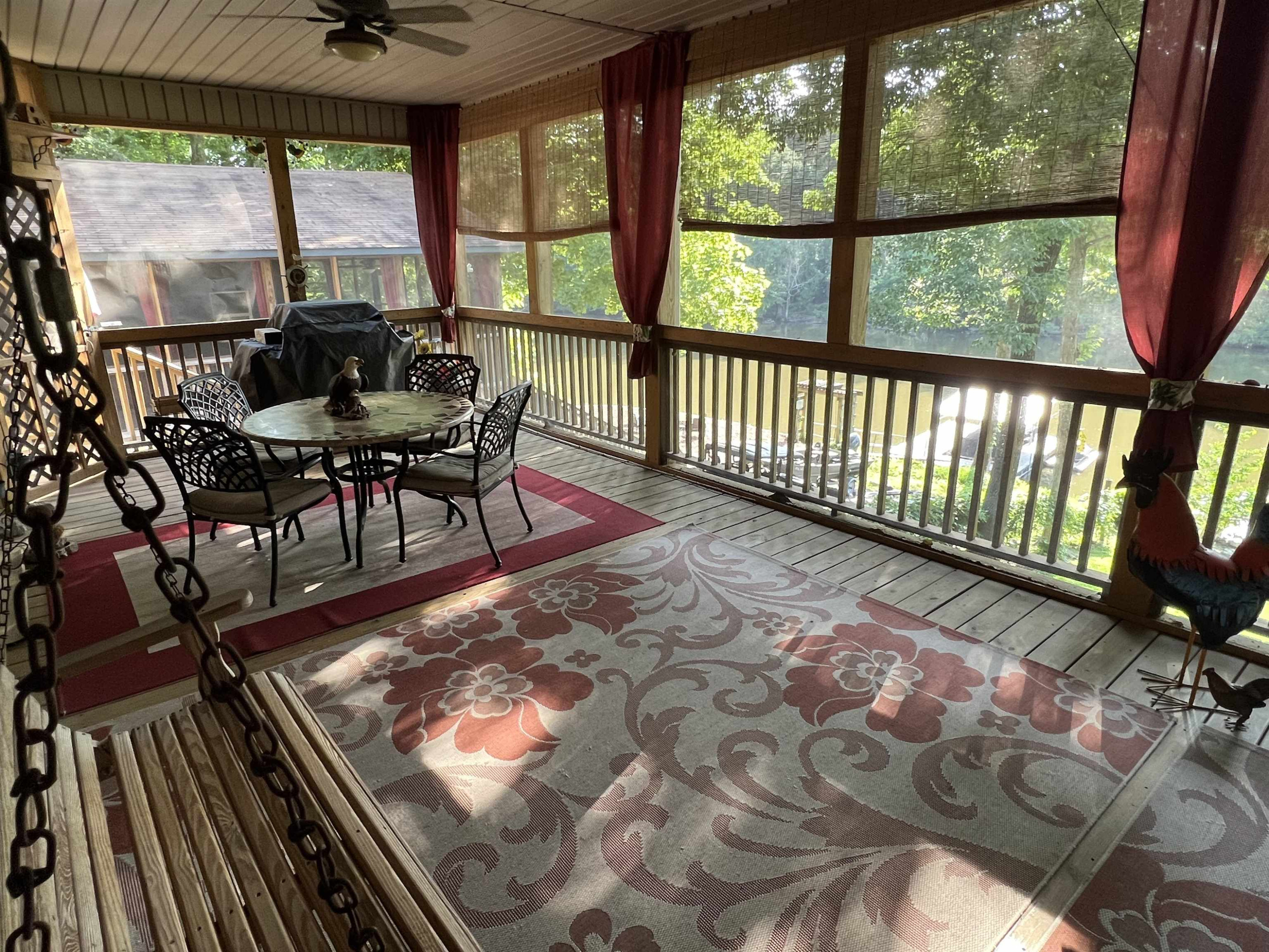 795 Lost Creek Boat Dock Road Decaturville, TN 38329 - Photo 21 of 34 a living room with a rug and a table