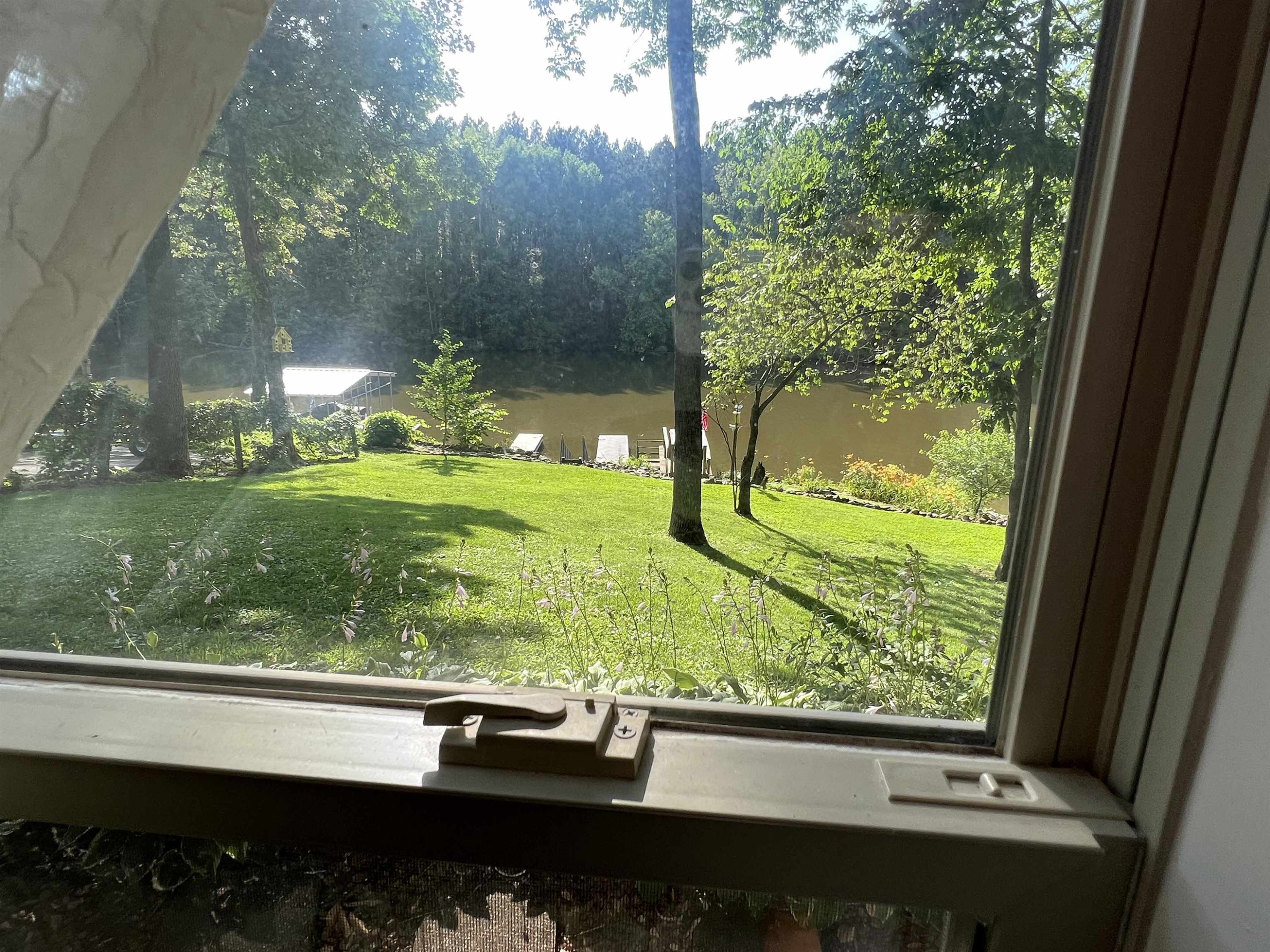 795 Lost Creek Boat Dock Road Decaturville, TN 38329 - Photo 22 of 34 a view of backyard from window