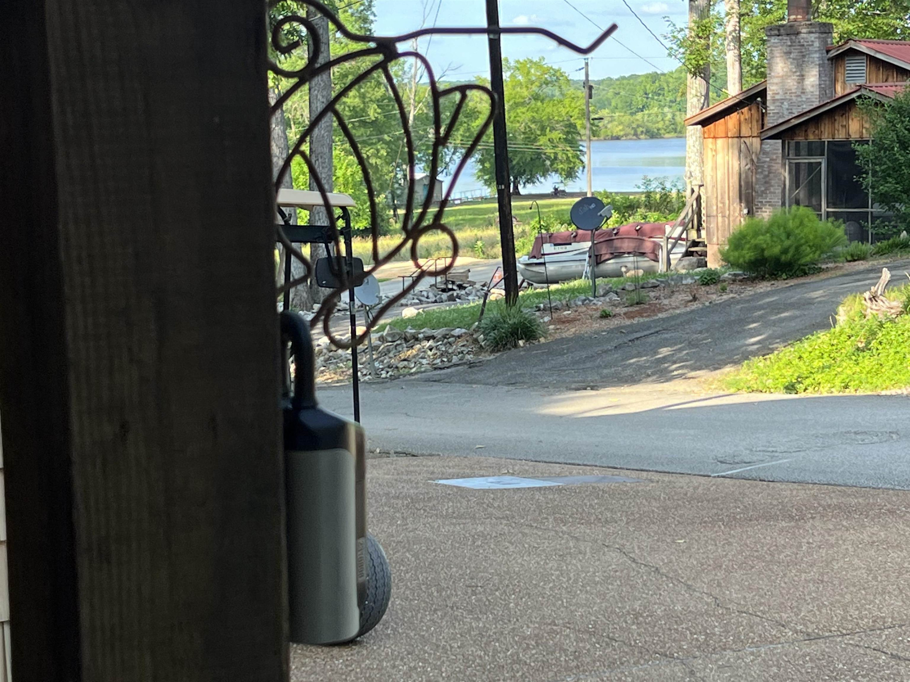795 Lost Creek Boat Dock Road Decaturville, TN 38329 - Photo 26 of 34 a view of street along with houses