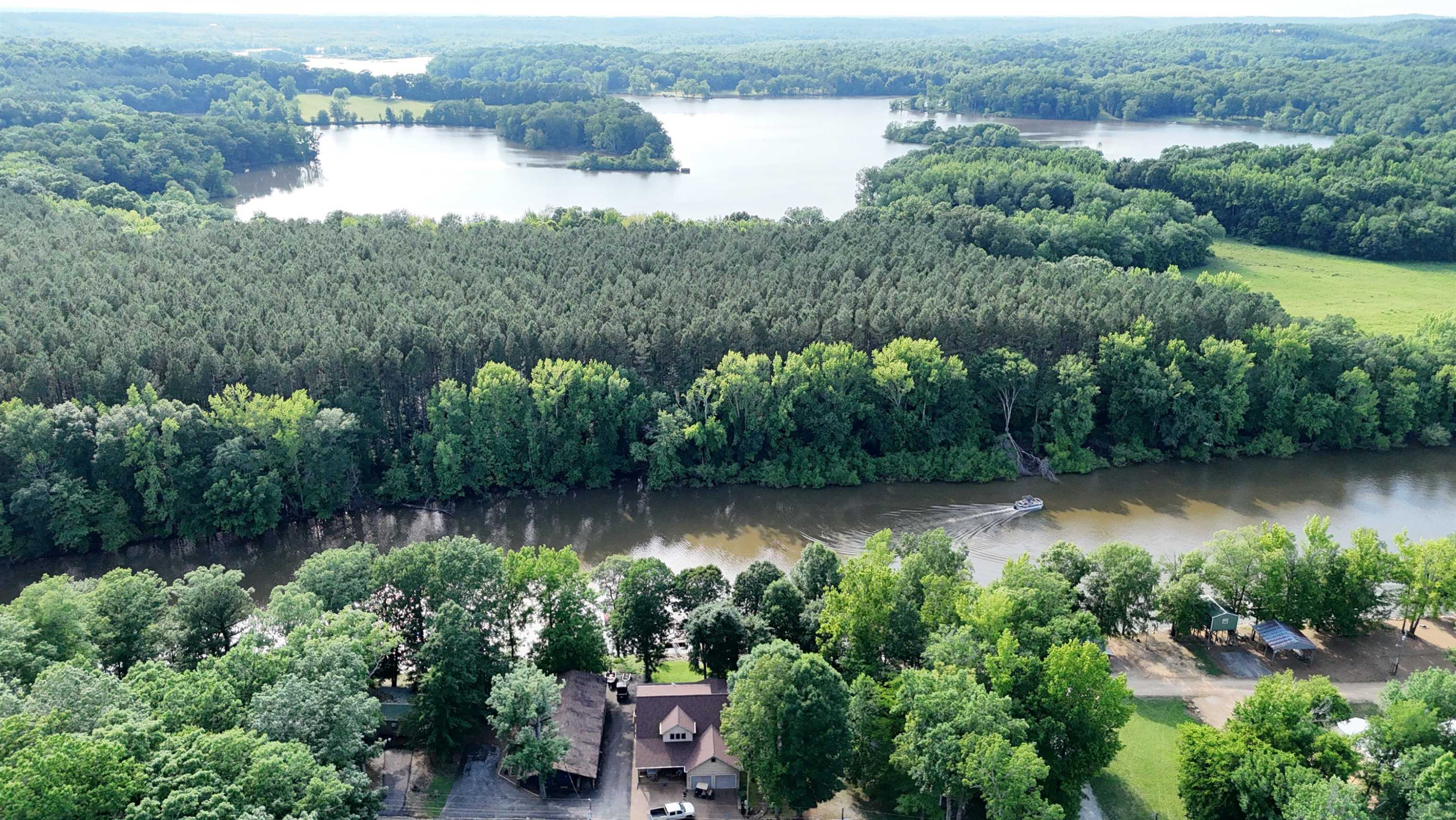 795 Lost Creek Boat Dock Road Decaturville, TN 38329 - Photo 27 of 34 an aerial view of a house with a yard and lake view