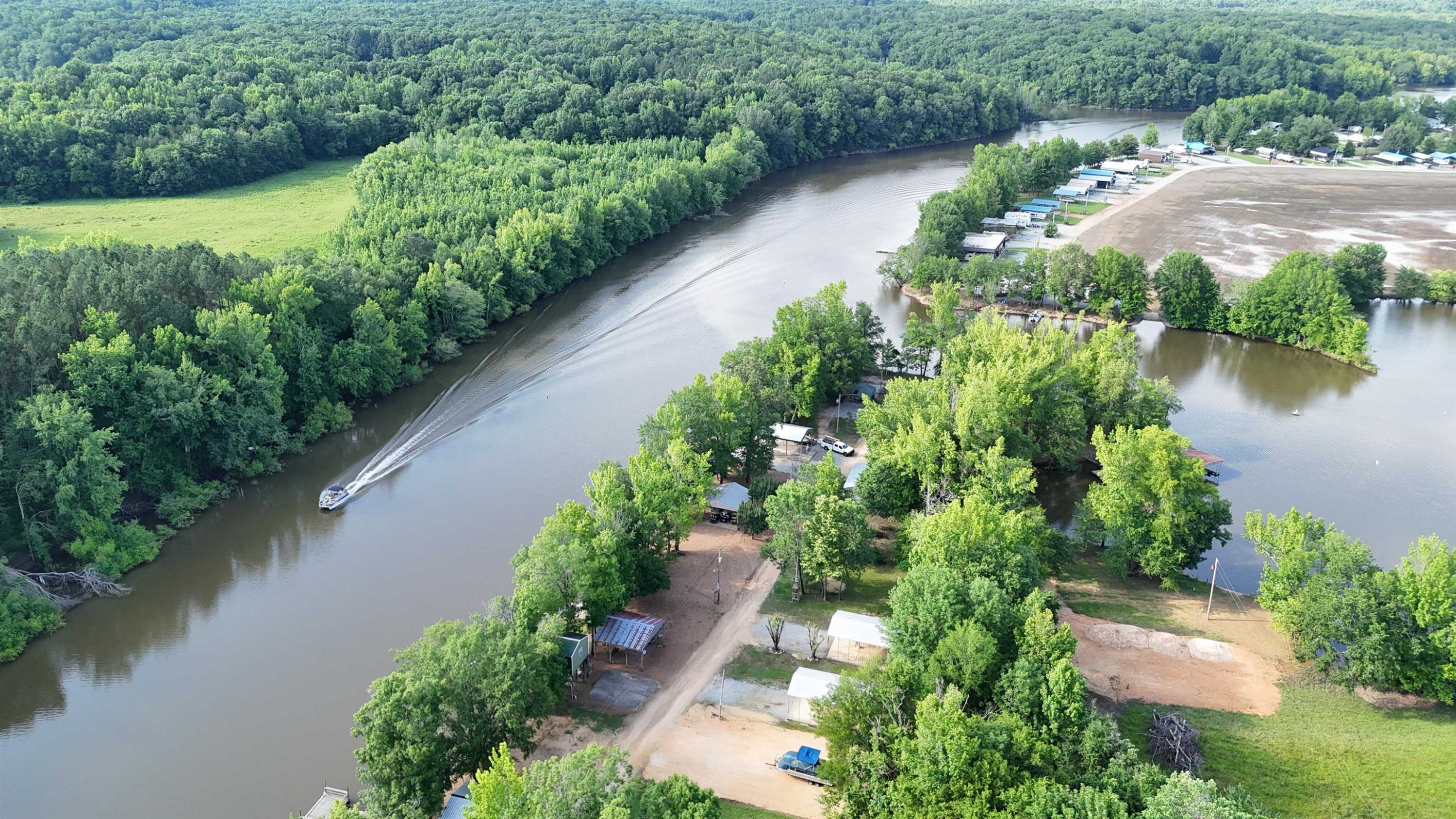 795 Lost Creek Boat Dock Road Decaturville, TN 38329 - Photo 28 of 34 an aerial view of a house with a yard and lake view