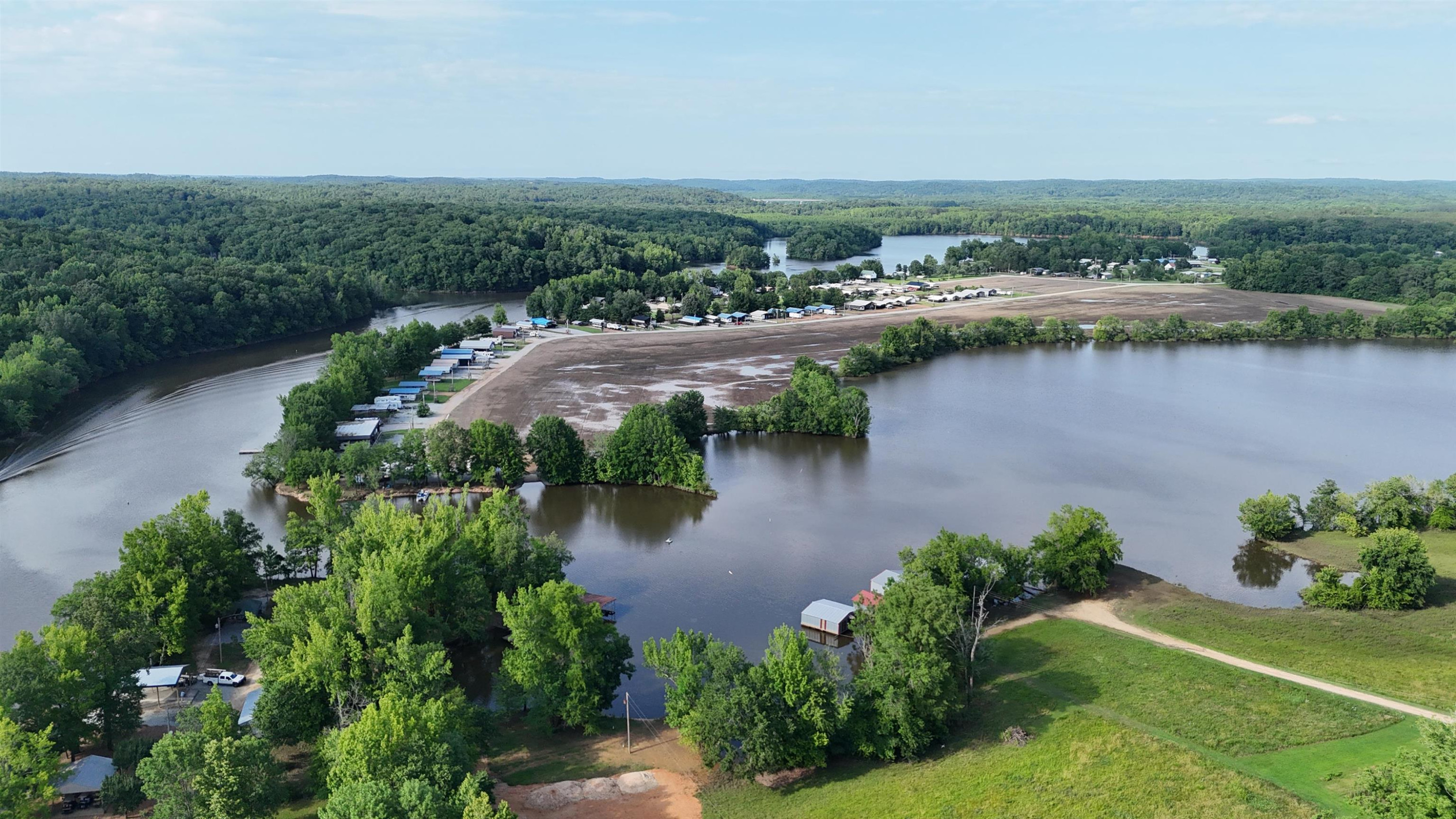 795 Lost Creek Boat Dock Road Decaturville, TN 38329 - Photo 29 of 34 an aerial view of a house with a yard and lake view