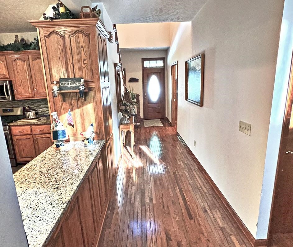 795 Lost Creek Boat Dock Road Decaturville, TN 38329 - Photo 3 of 34 a view of a living room with a wooden floor