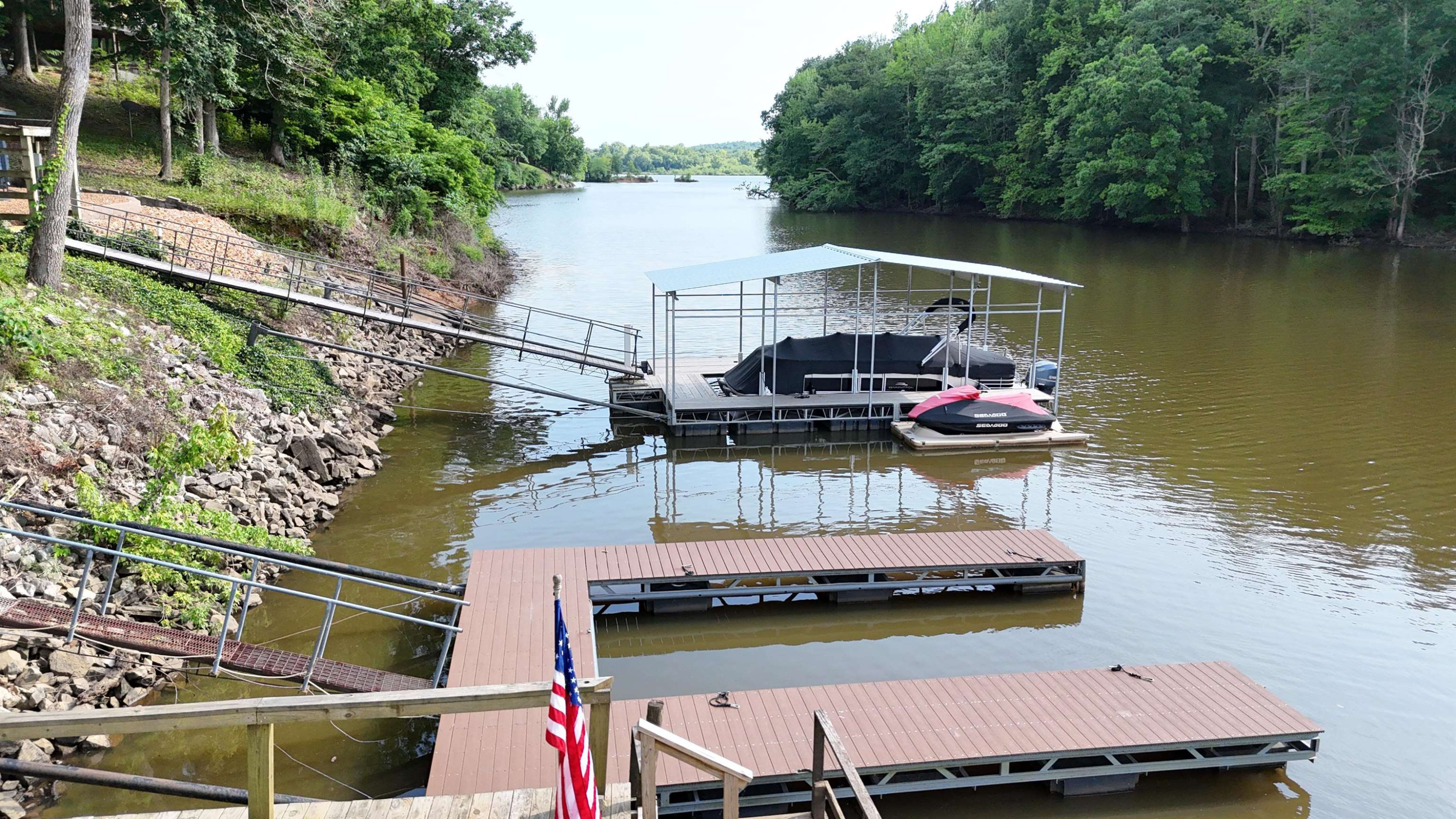 795 Lost Creek Boat Dock Road Decaturville, TN 38329 - Photo 31 of 34 a small pool with a table and chairs