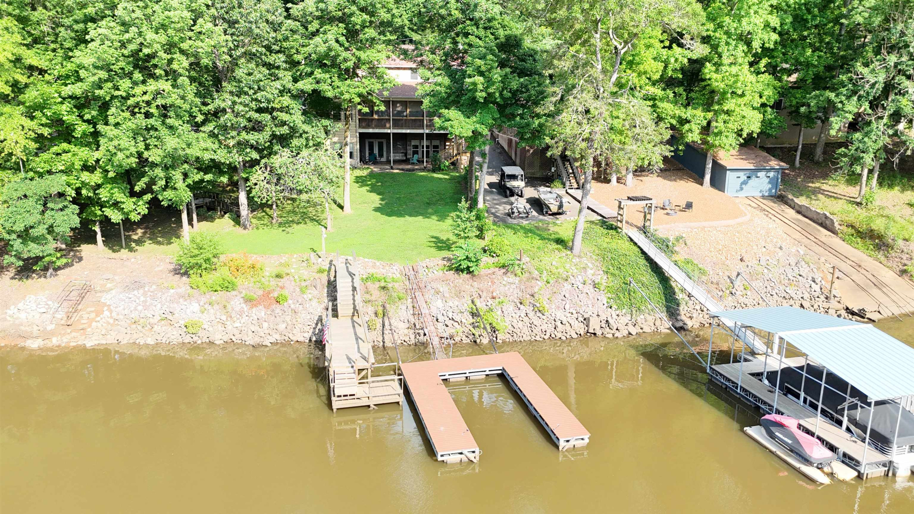 795 Lost Creek Boat Dock Road Decaturville, TN 38329 - Photo 32 of 34 a view of a swimming pool with a patio