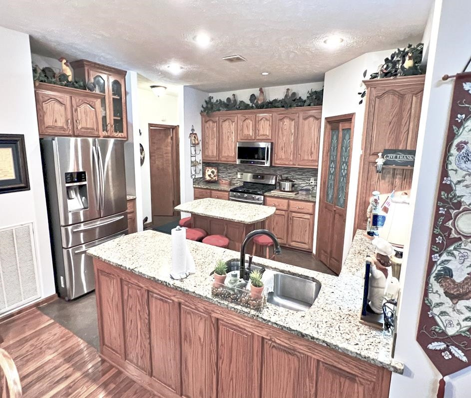 795 Lost Creek Boat Dock Road Decaturville, TN 38329 - Photo 5 of 34 a kitchen with stainless steel appliances granite countertop a refrigerator and a sink