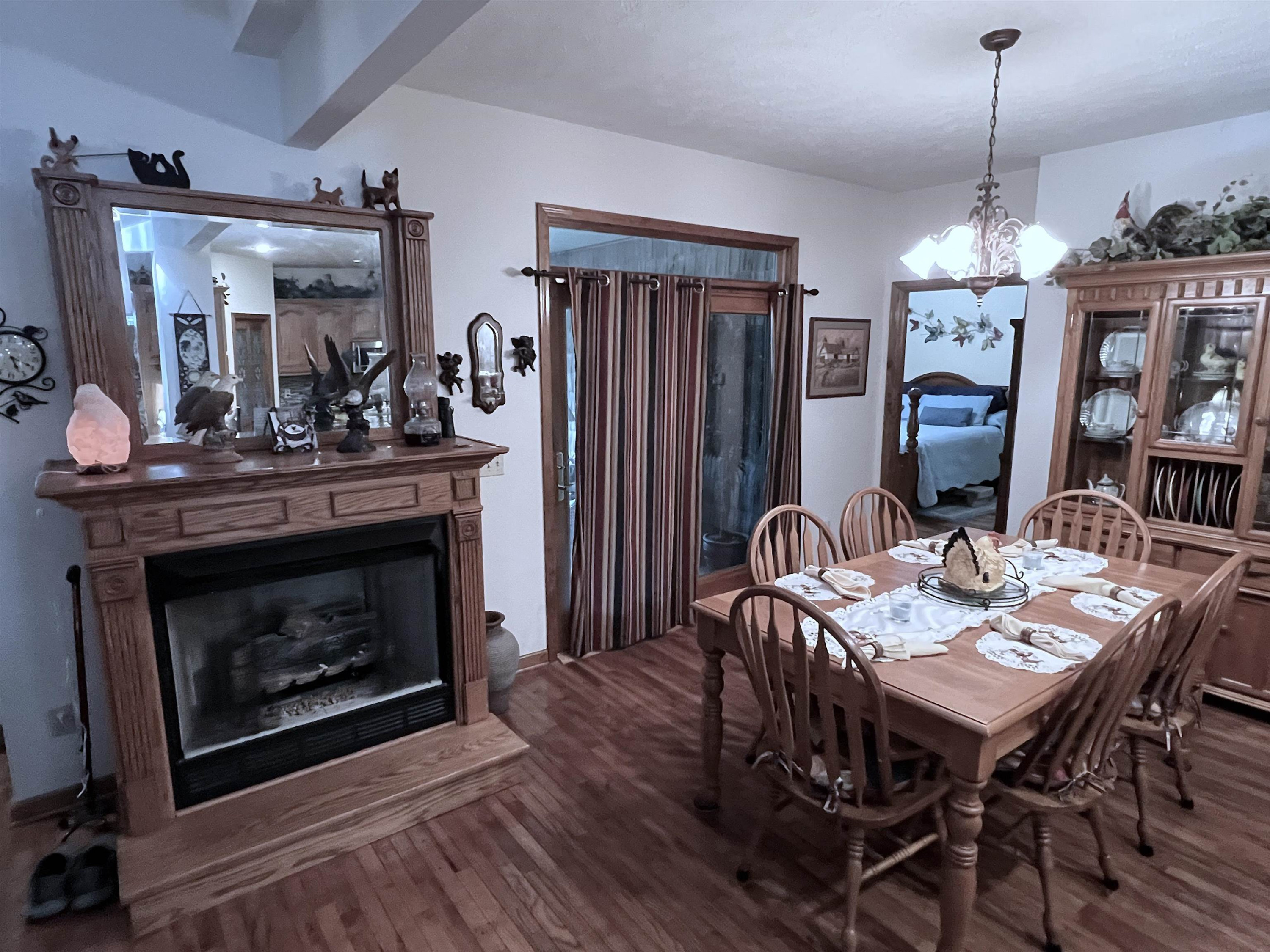 795 Lost Creek Boat Dock Road Decaturville, TN 38329 - Photo 7 of 34 a view of a dining room with furniture window and wooden floor