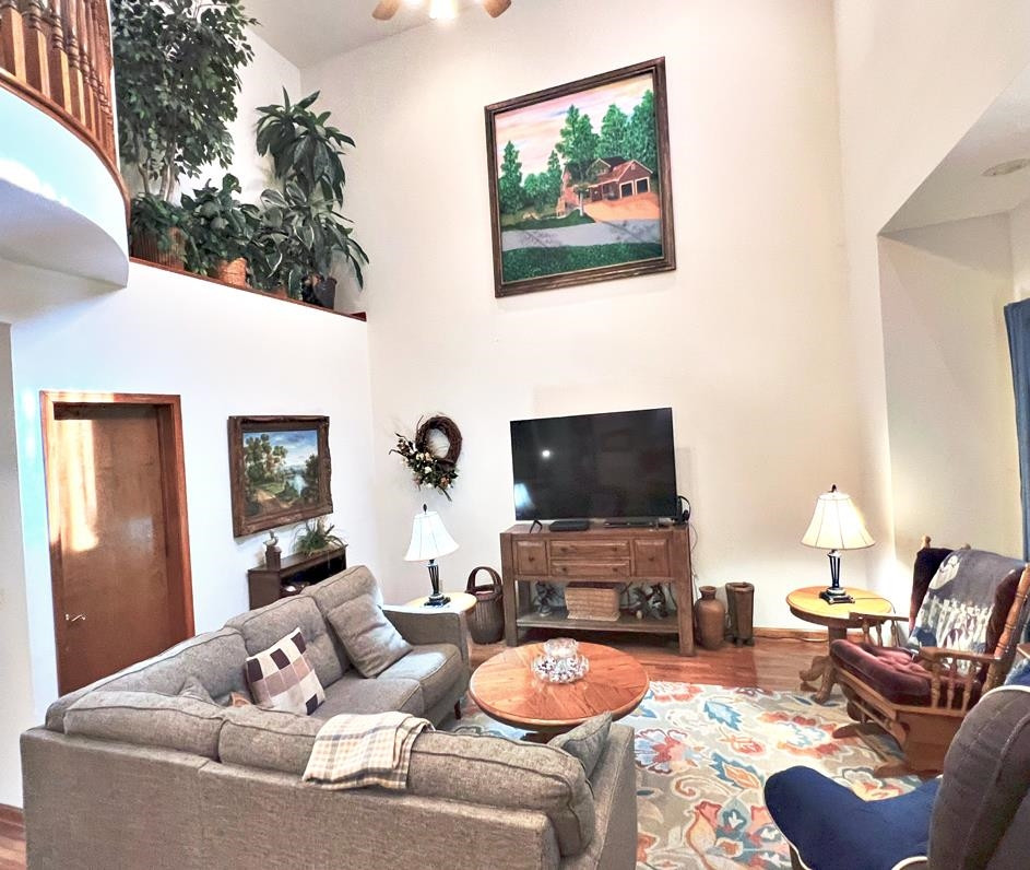 795 Lost Creek Boat Dock Road Decaturville, TN 38329 - Photo 8 of 34 a living room with furniture and a flat screen tv