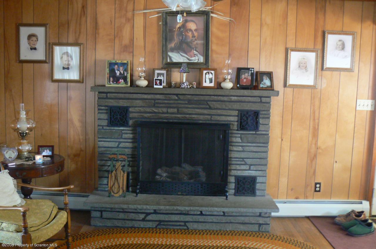 85 Stove Pipe Road Waymart, PA 18472 - Photo 5 of 21 a living room with furniture and a fireplace