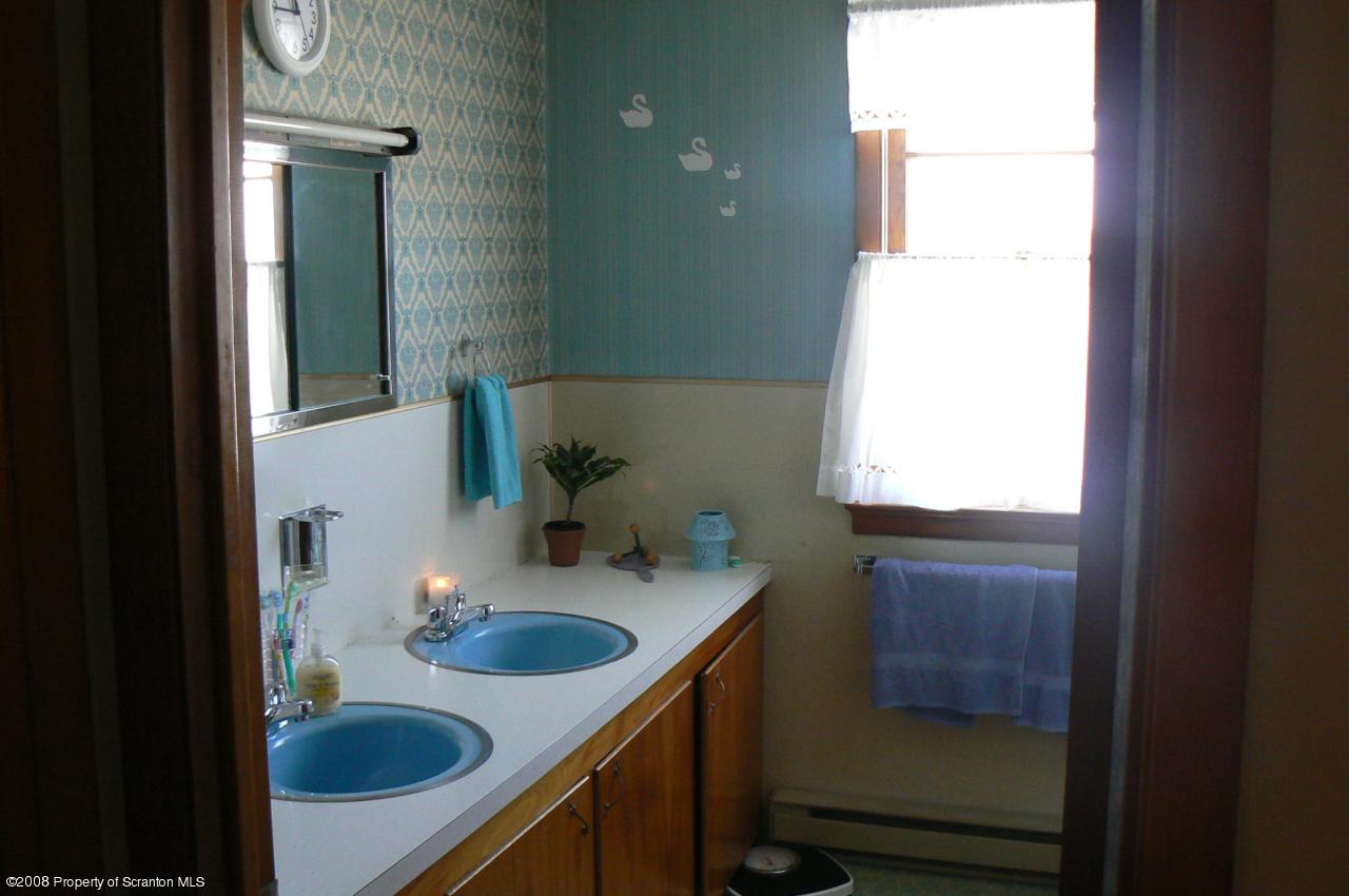 85 Stove Pipe Road Waymart, PA 18472 - Photo 9 of 21 a bathroom with a sink and a mirror