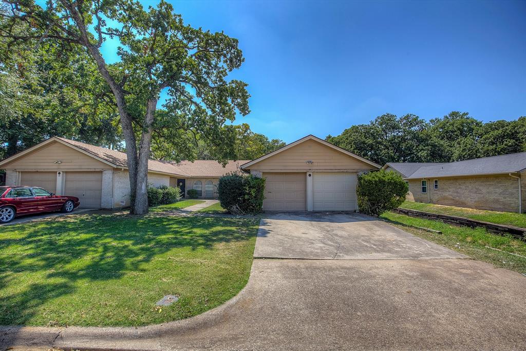 611 Melbourne Road Hurst, TX 76053 - Photo 1 of 1 a view of a house with a small yard