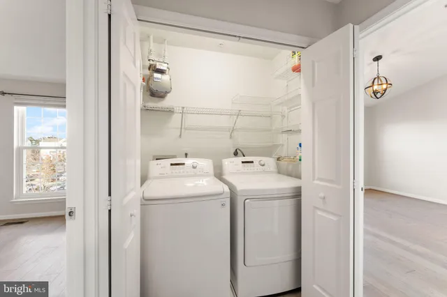 a view of bathroom with a sink and washer