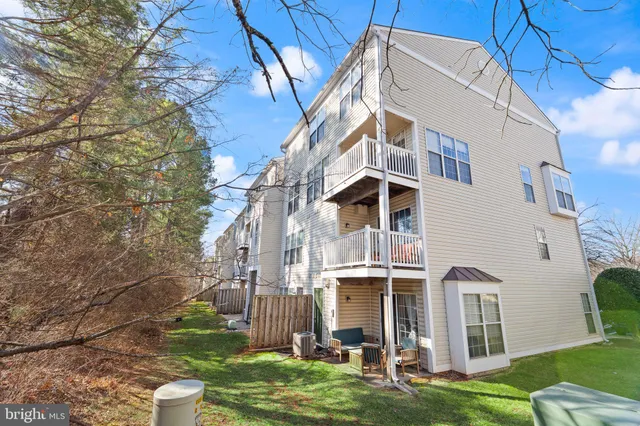 a view of a big building next to a yard