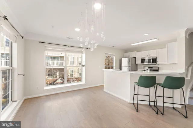a view of kitchen with furniture and large window