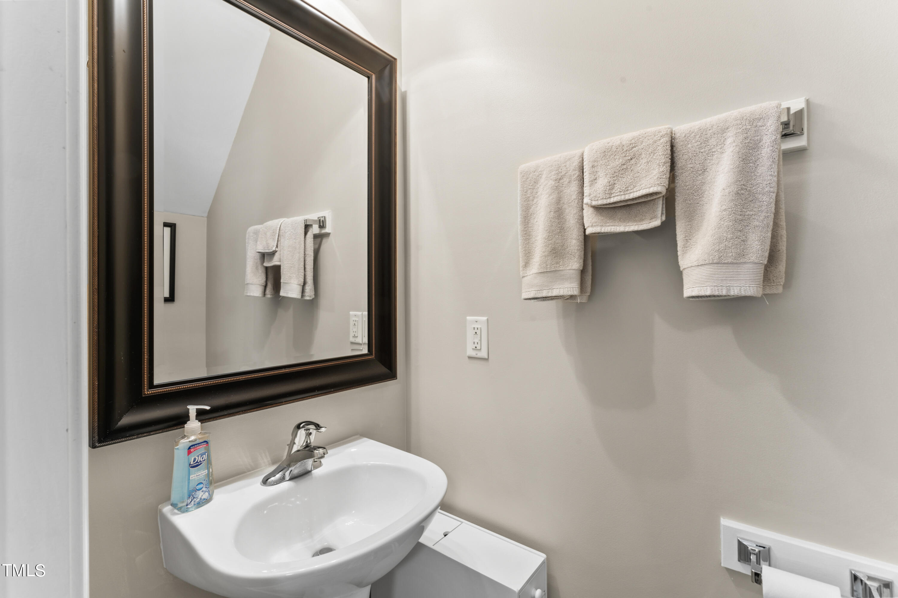 4522 Shady Side Lane Durham, NC 27713 - Photo 22 of 28 a bathroom with a sink and a mirror