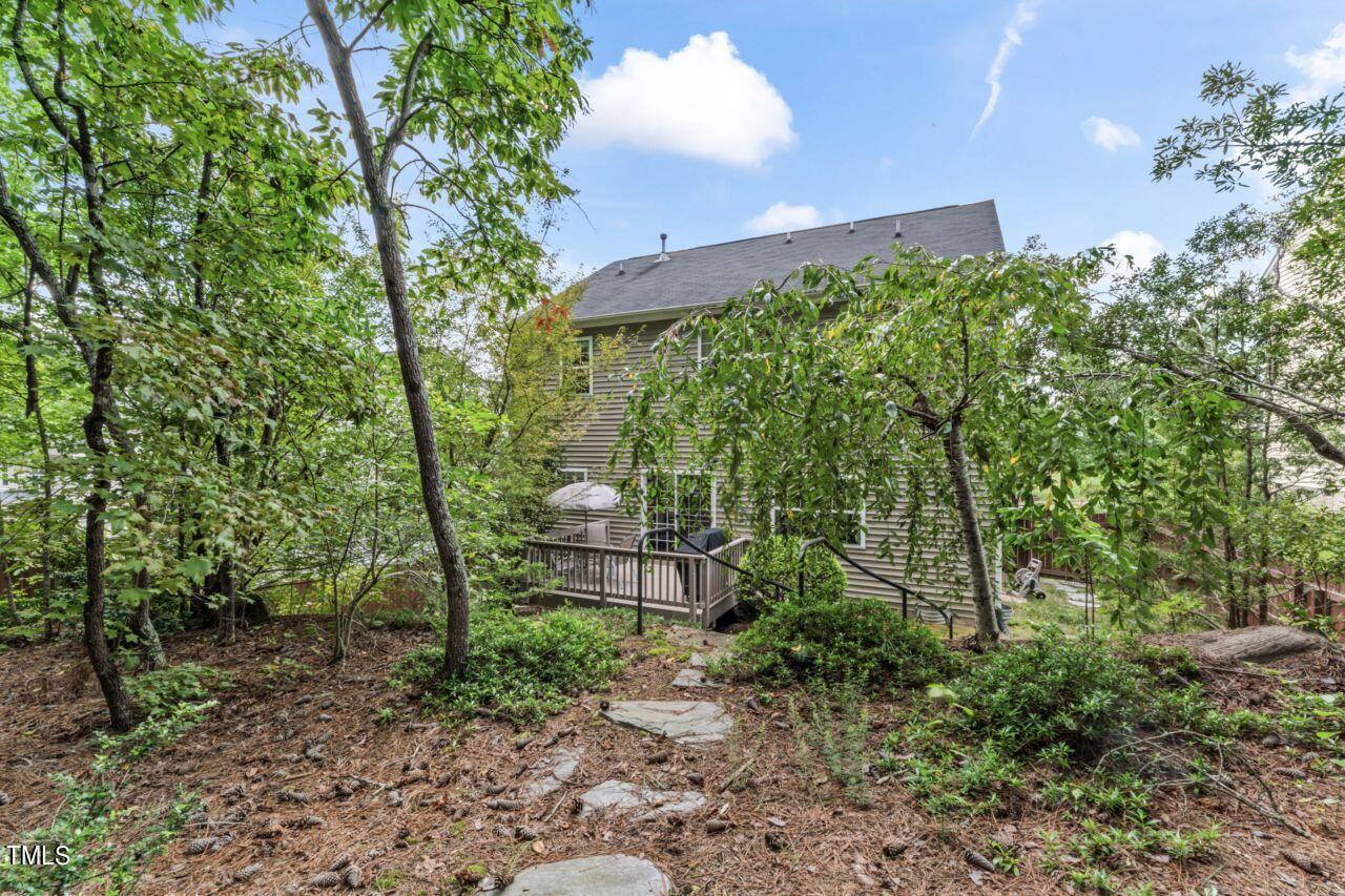 4522 Shady Side Lane Durham, NC 27713 - Photo 26 of 28 a view of a yard with plants and large trees