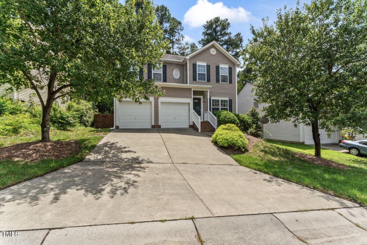 4522 Shady Side Lane Durham, NC 27713 - Photo 28 of 28 a view of a house with a yard and large tree