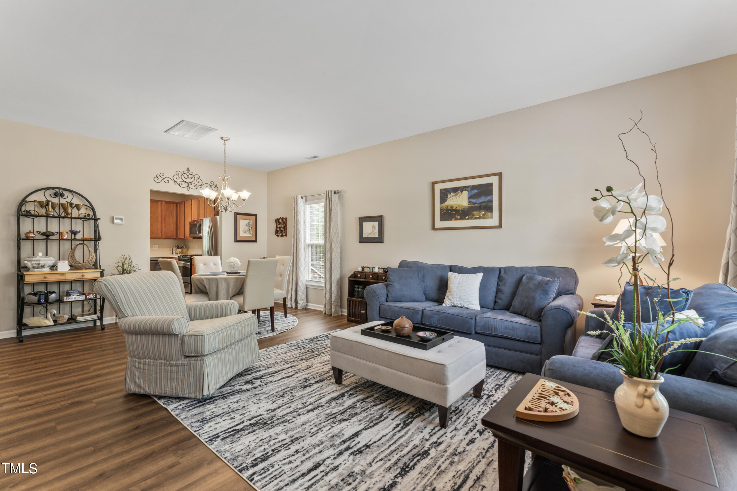 4522 Shady Side Lane Durham, NC 27713 - Photo 3 of 28 a living room with furniture potted plant and a window