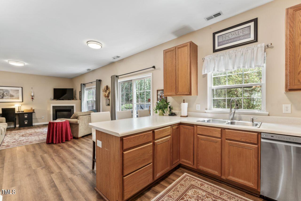 4522 Shady Side Lane Durham, NC 27713 - Photo 5 of 28 a kitchen with a sink stove and cabinets