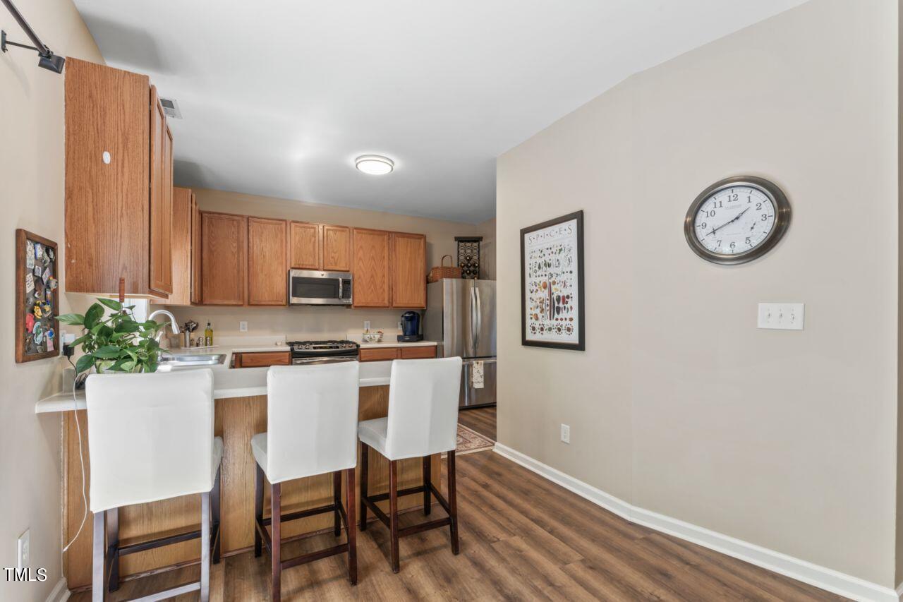 4522 Shady Side Lane Durham, NC 27713 - Photo 7 of 28 a kitchen with a table and chairs