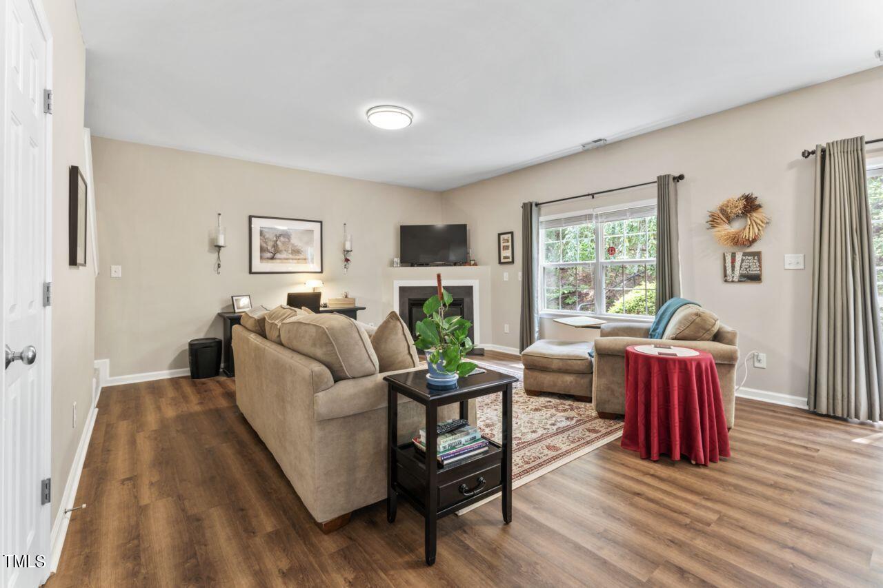 4522 Shady Side Lane Durham, NC 27713 - Photo 8 of 28 a living room with furniture and a wooden floor