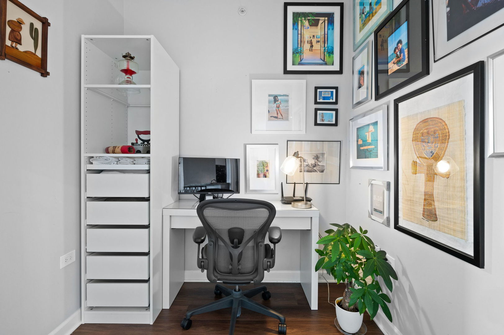 100 East 14th Street, Unit 2809 Chicago, IL 60605 - Photo 11 of 24 a view of a workspace with furniture and a window