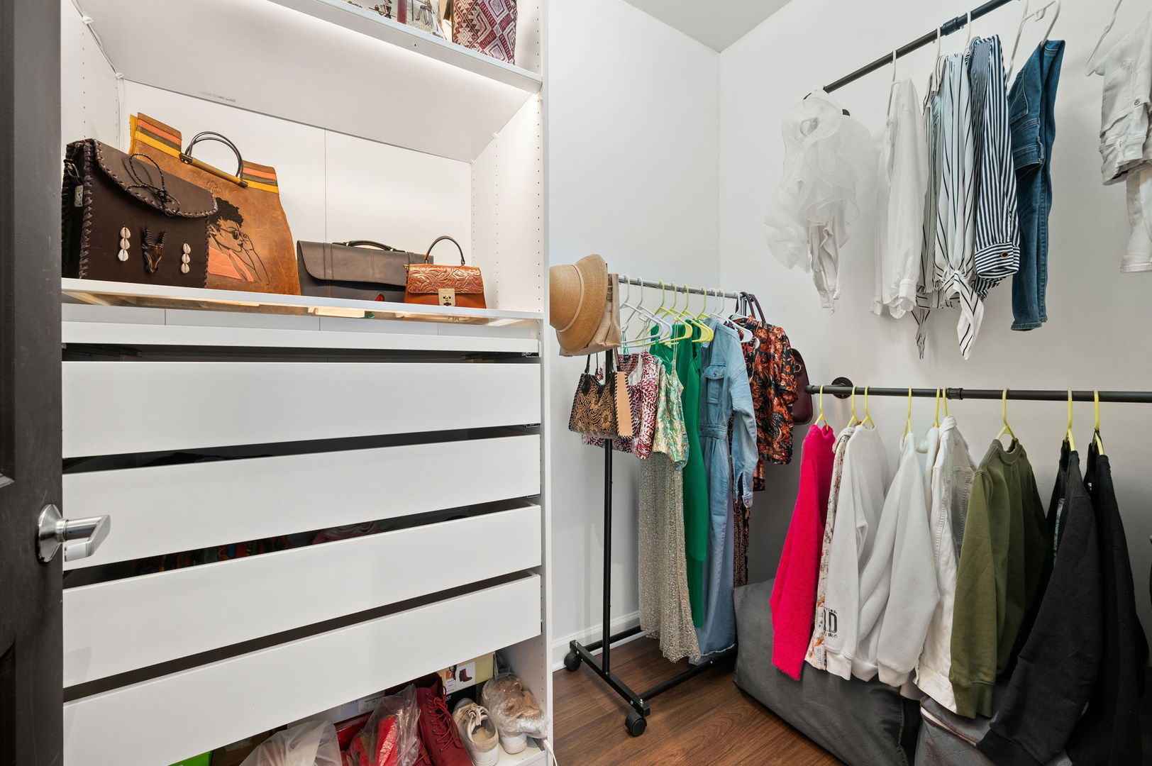 100 East 14th Street, Unit 2809 Chicago, IL 60605 - Photo 14 of 24 a view of walk in closet with clothes and shoes