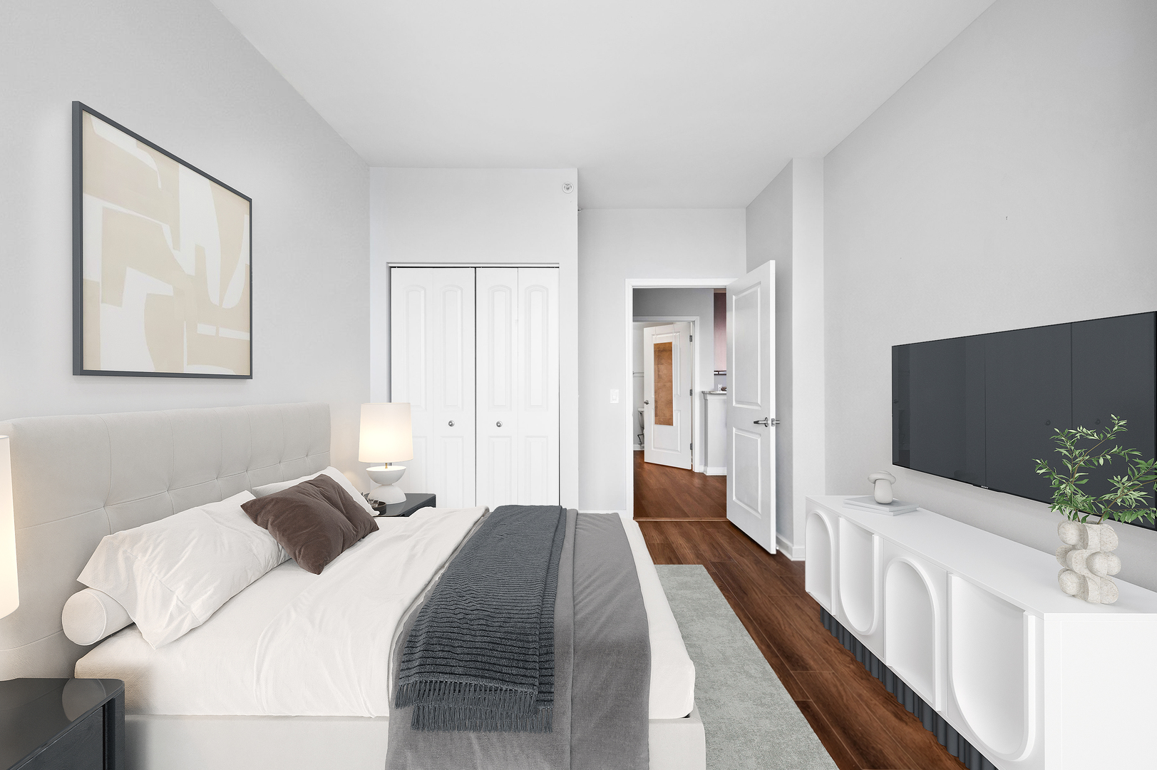 100 East 14th Street, Unit 2809 Chicago, IL 60605 - Photo 18 of 24 a bedroom with a bed and a flat screen tv