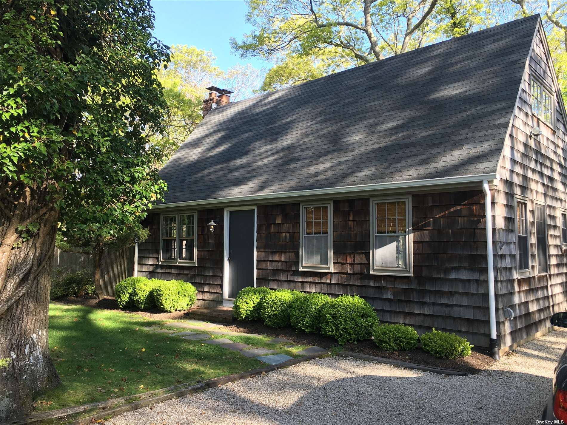 2 Rutland Road East Hampton, NY 11937 - Photo 1 of 1 a front view of a house with garden