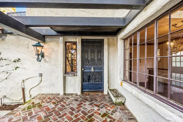 a view of a hallway view with wooden floor and staircase