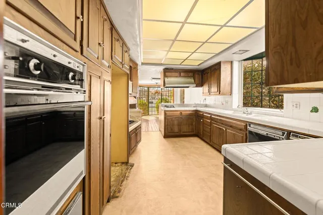 a view of a big room with wooden floor and stairs