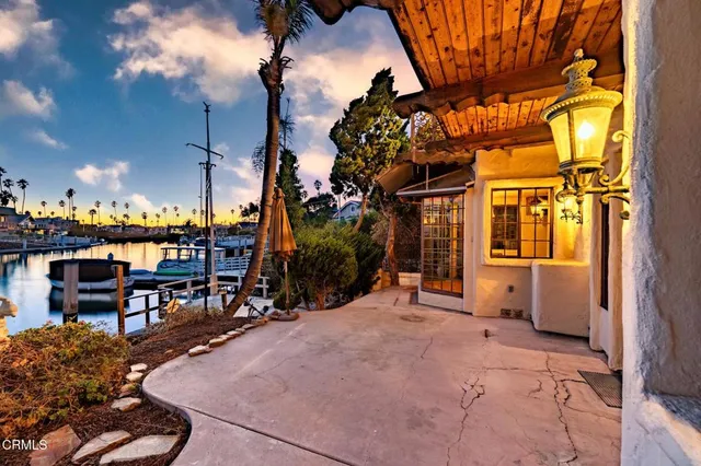 a view of a house next to a yard