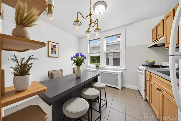 a kitchen with a table and chairs in it