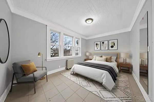 a bed room with a bed and a chair