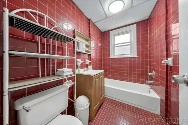 a bathroom with a sink a bathtub and a toilet