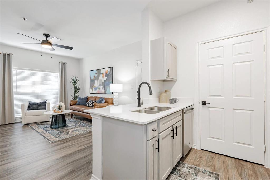 1600 North 9th Street, Unit C1 Midlothian, TX 76065 - Photo 38 of 40 a kitchen with a sink and cabinets