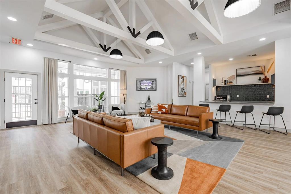 1600 North 9th Street, Unit C1 Midlothian, TX 76065 - Photo 28 of 40 a living room with furniture and wooden floors