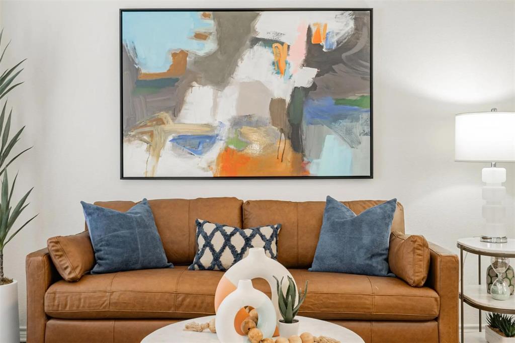 1600 North 9th Street, Unit C1 Midlothian, TX 76065 - Photo 33 of 40 a living room with furniture and painting on the wall