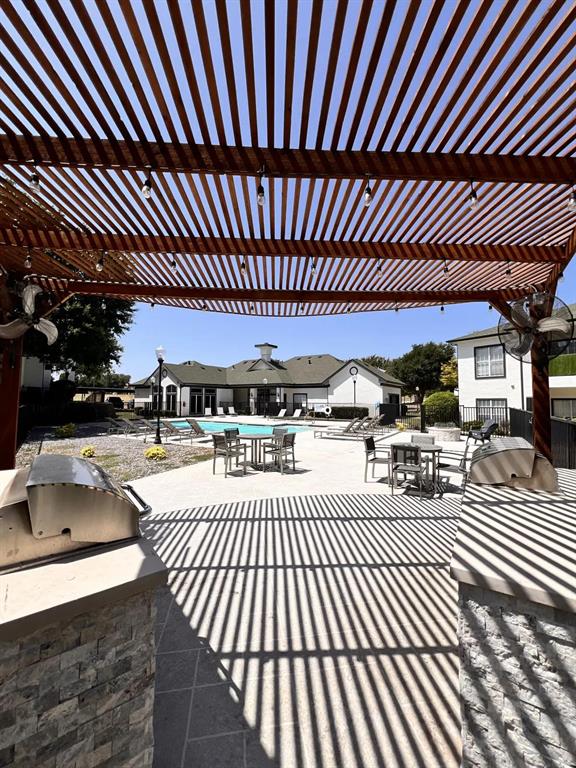 1600 North 9th Street, Unit C1 Midlothian, TX 76065 - Photo 8 of 40 a view of a swimming pool and patio