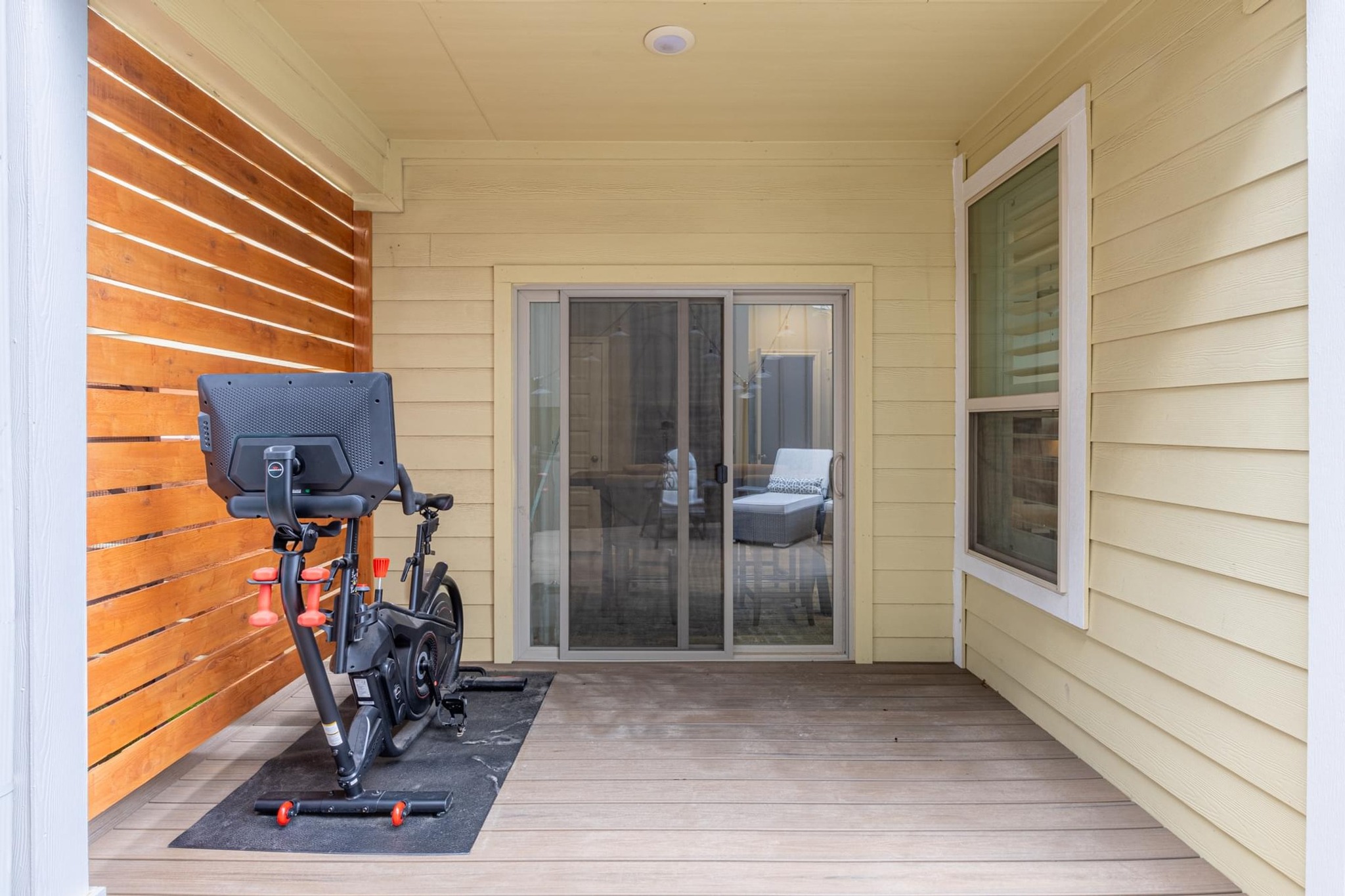 7801 Frida Bend Austin, TX 78744 - Photo 25 of 26 A private covered deck offers a dedicated space for fitness and outdoor enjoyment.